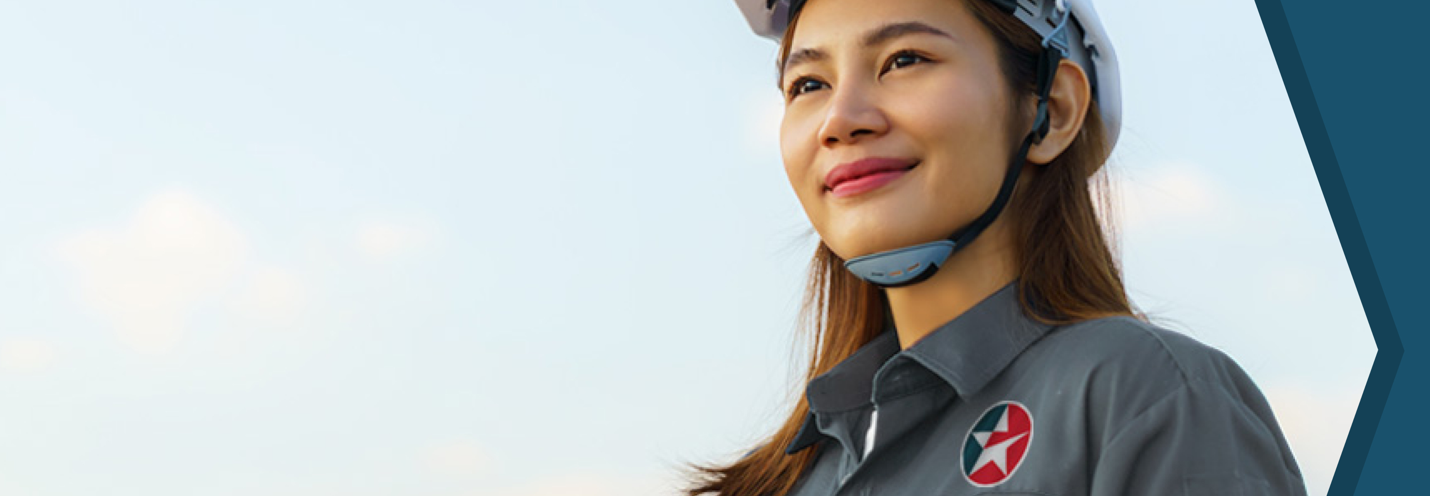 Female Caltex engineer looking into the distance