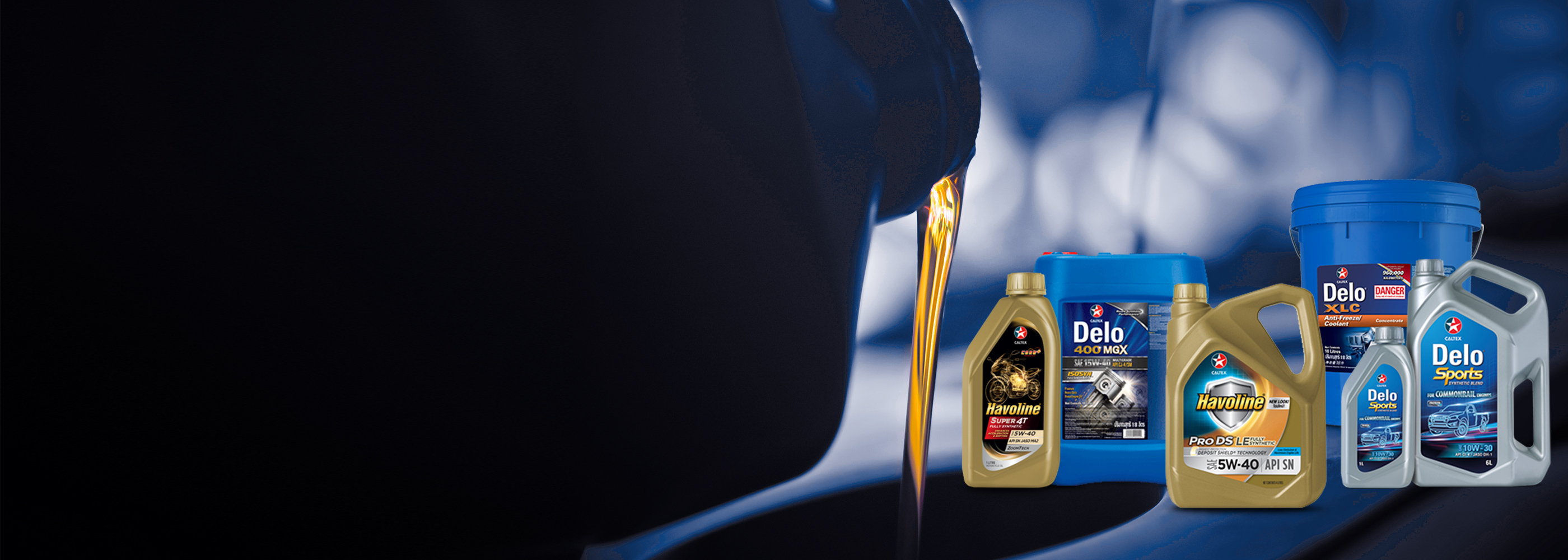 Various Caltex lubricant products overlayed on a backlit image of oil pouring into an engine