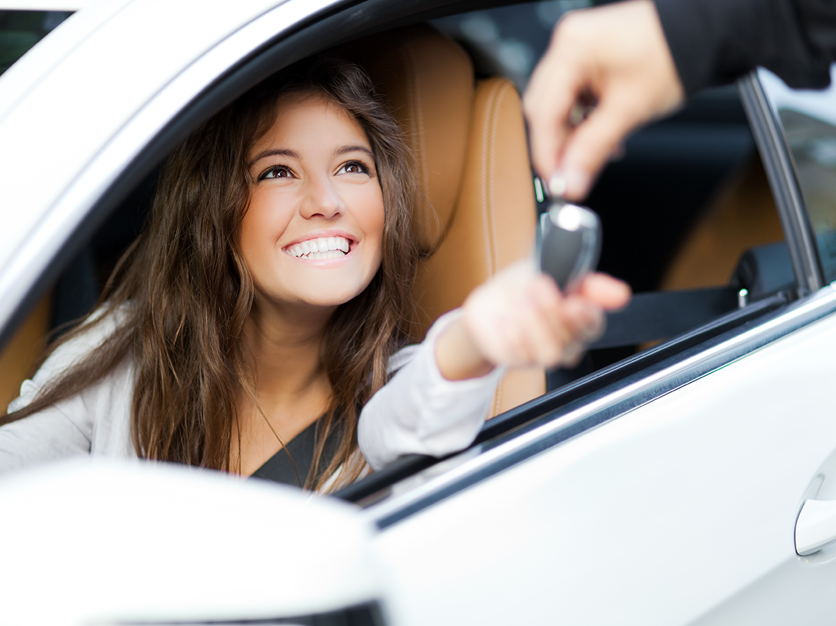 Woman receiving car keys