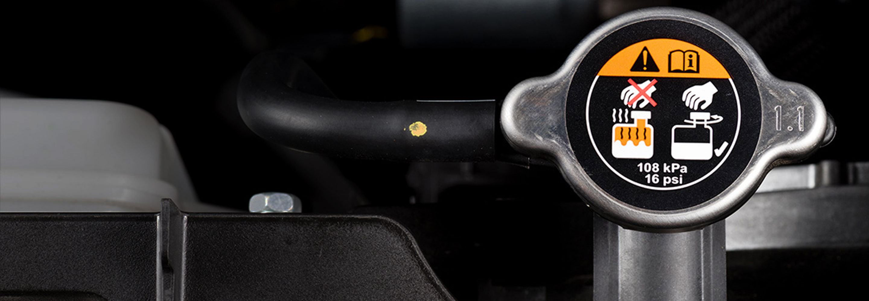Warning signs on a coolant cap